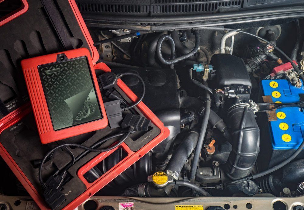 A Close Up of a Car Engine With a Diagnostic Tool — A Plus Automotive Electrical In Albury, NSW