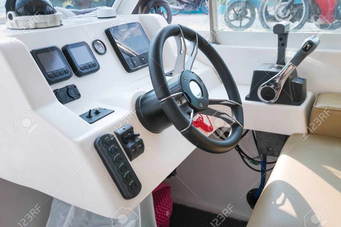 The Interior of a Boat With a Steering Wheel and Controls — A Plus Automotive Electrical in Lavington, NSW