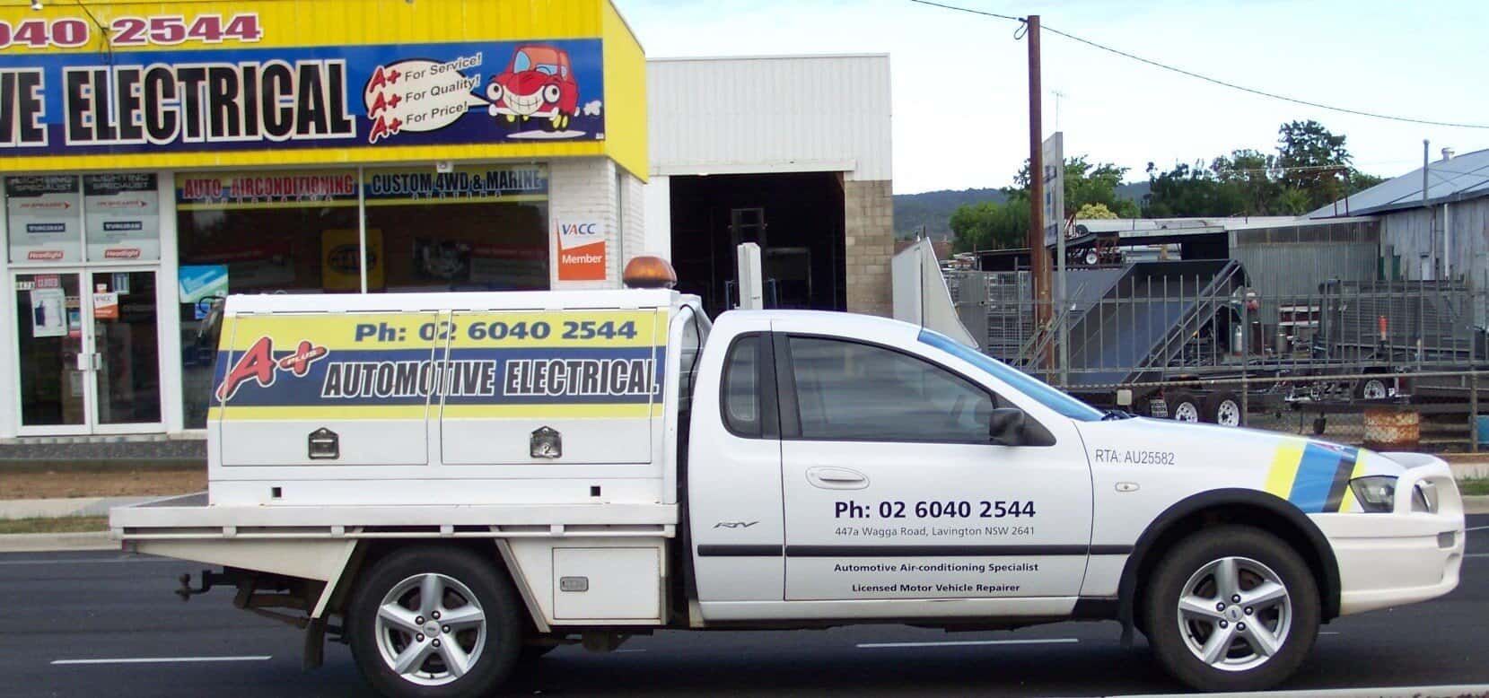 A White Truck is Parked in Front of an Electrical Store — A Plus Automotive Electrical In Lavington, NSW