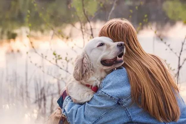 A Woman is Holding a Dog in Her Arms — Pets Forever Cremations In North Lakes, QLD