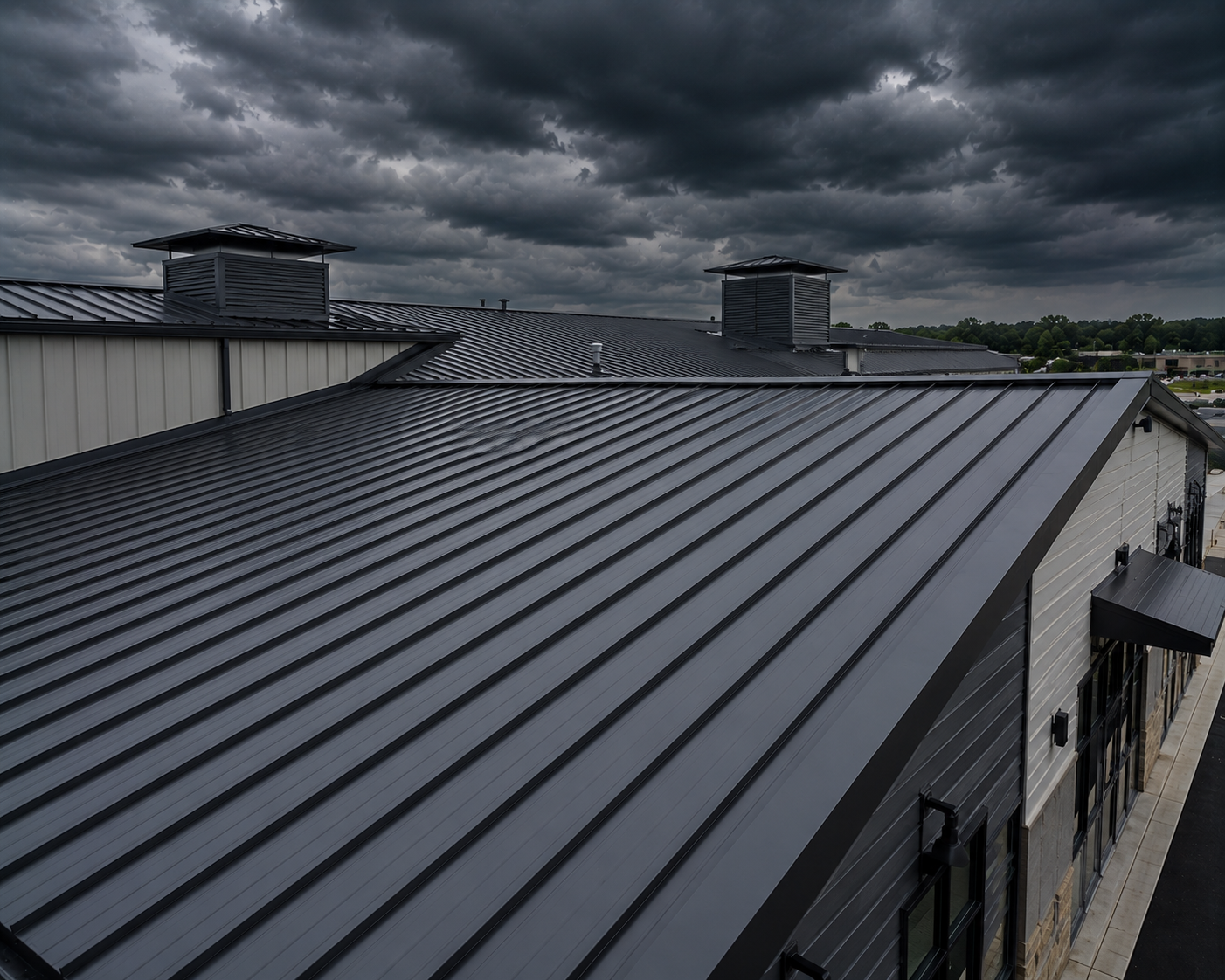Dark gray metal roof under stormy clouds with industrial buildings in the background