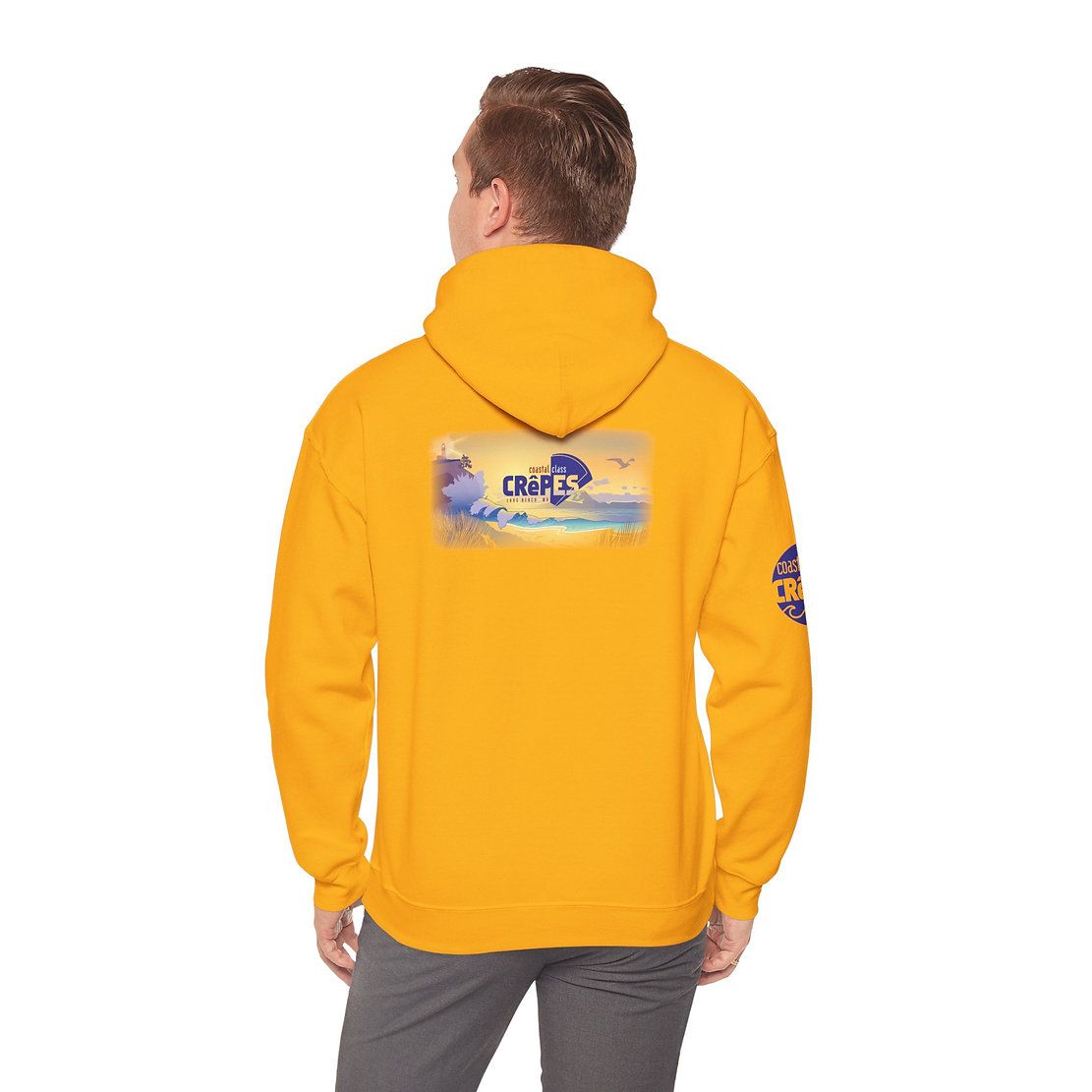 Rear view of a person wearing a bright yellow hoodie with a colorful back graphic and sleeve patch