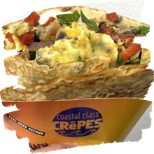 A savory crepe with vegetables in a Coastal Class Crepes paper cone.