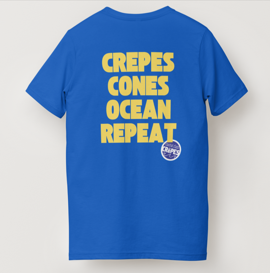 Blue T-shirt with yellow text reading “CREPES CONES OCEAN REPEAT”