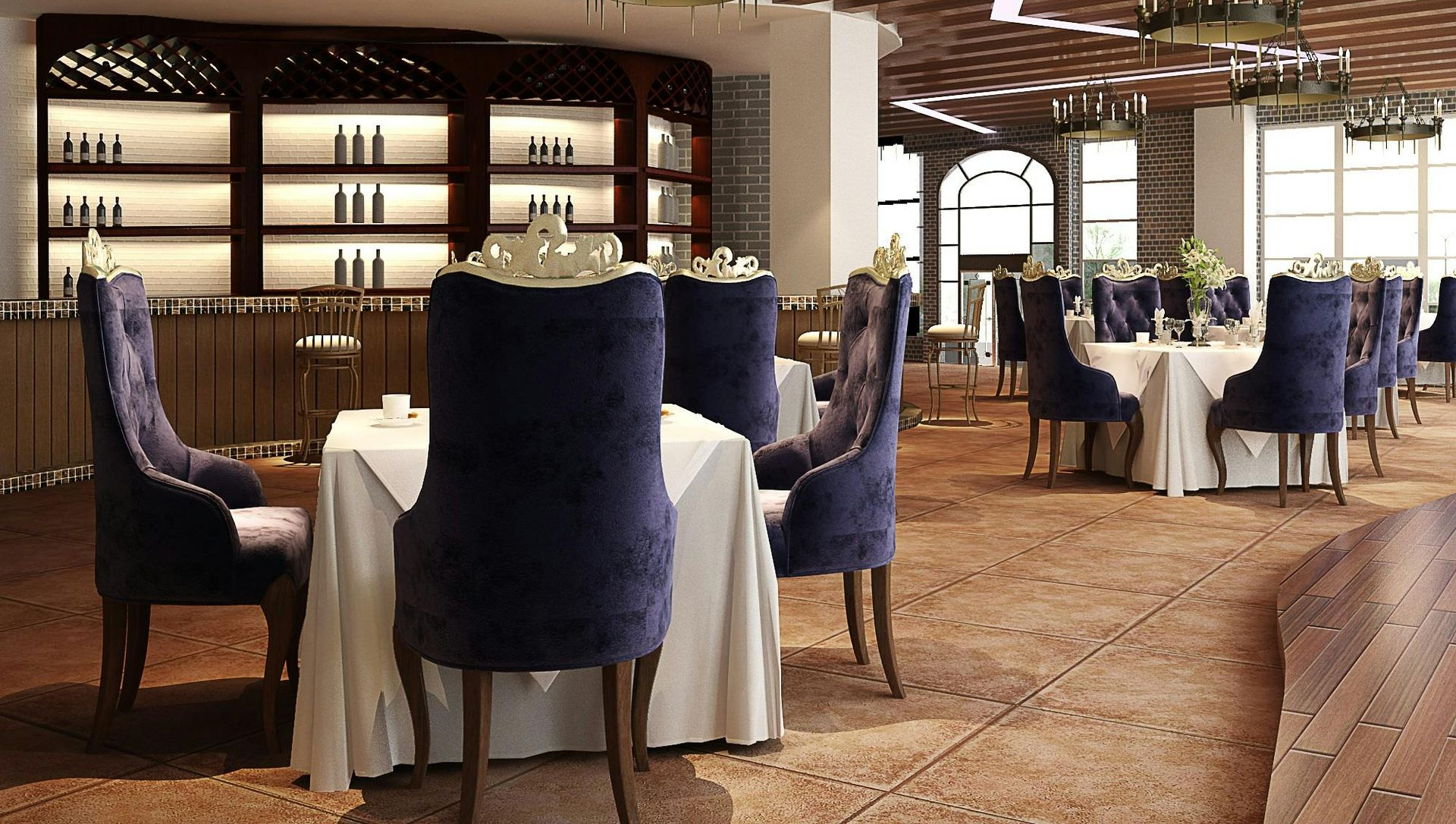 Restaurant interior with tables, blue velvet chairs, bar, and chandeliers.