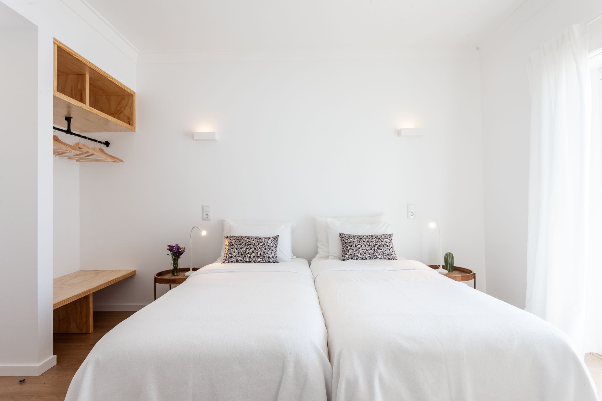 a bedroom with two beds and a window .