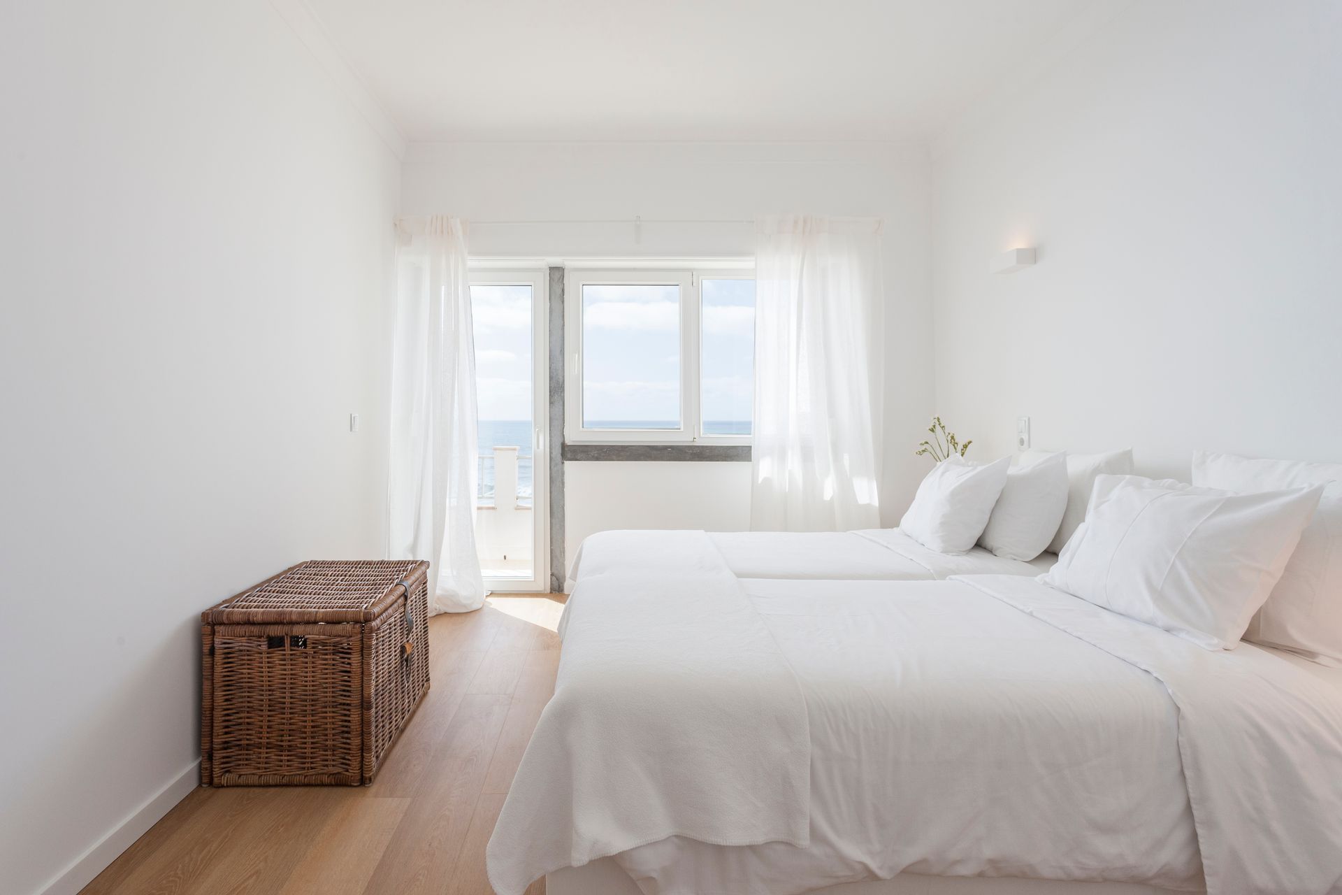 a bedroom with a large bed and a window .