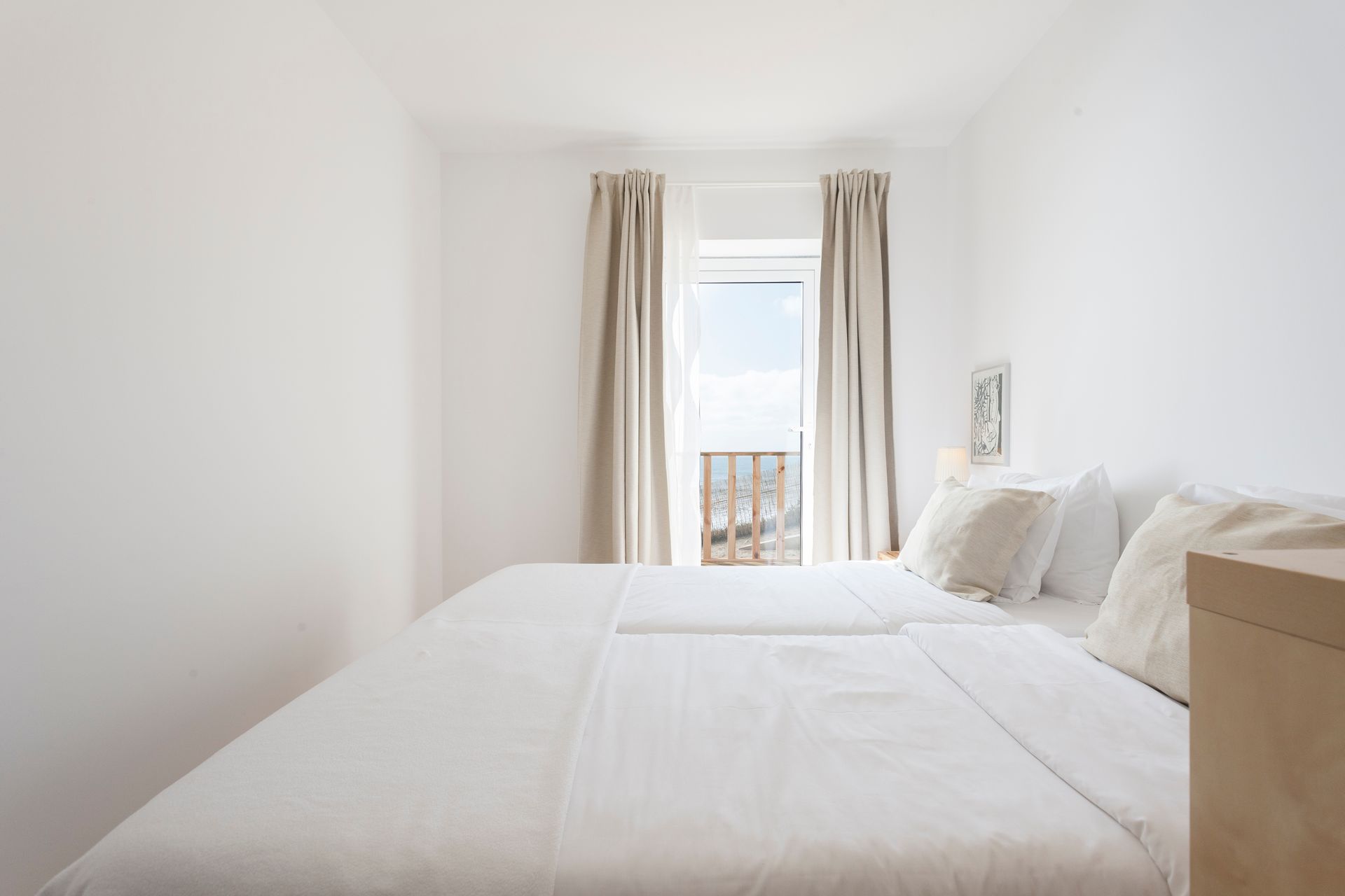 there is a large bed in the middle of the room .