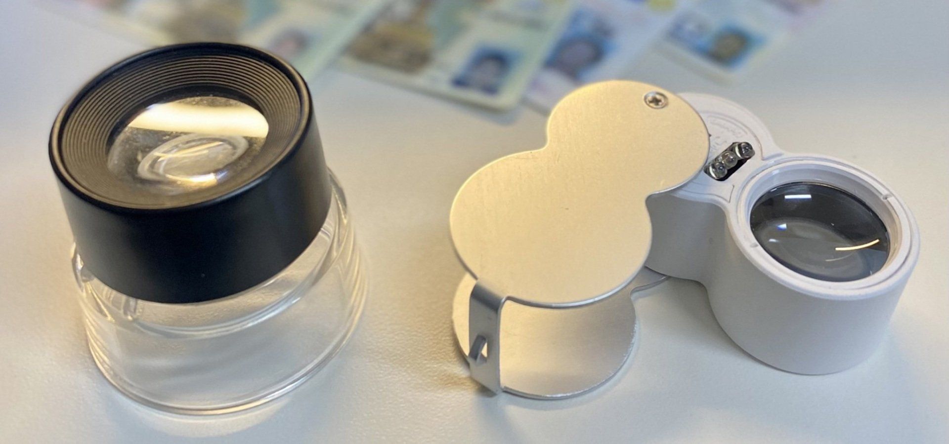 A magnifying glass and identification.
