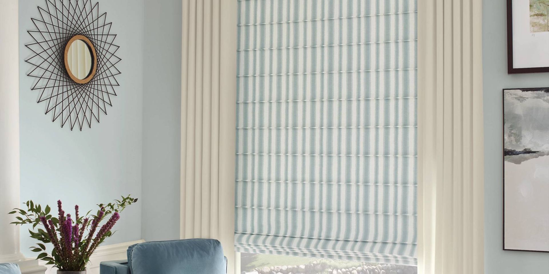 Gray Hunter Douglas Carole Fabrics™ Roman Shades over a window seat near West Chester, OH, and Florence, KY