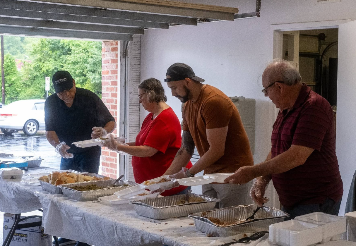 Staff and Community members enjoying some fresh, hot, North Carolina BBQ.