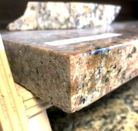 A close up of a piece of granite on a table.