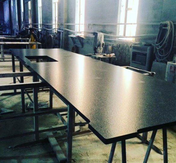 A long black table with a hole in the middle of it