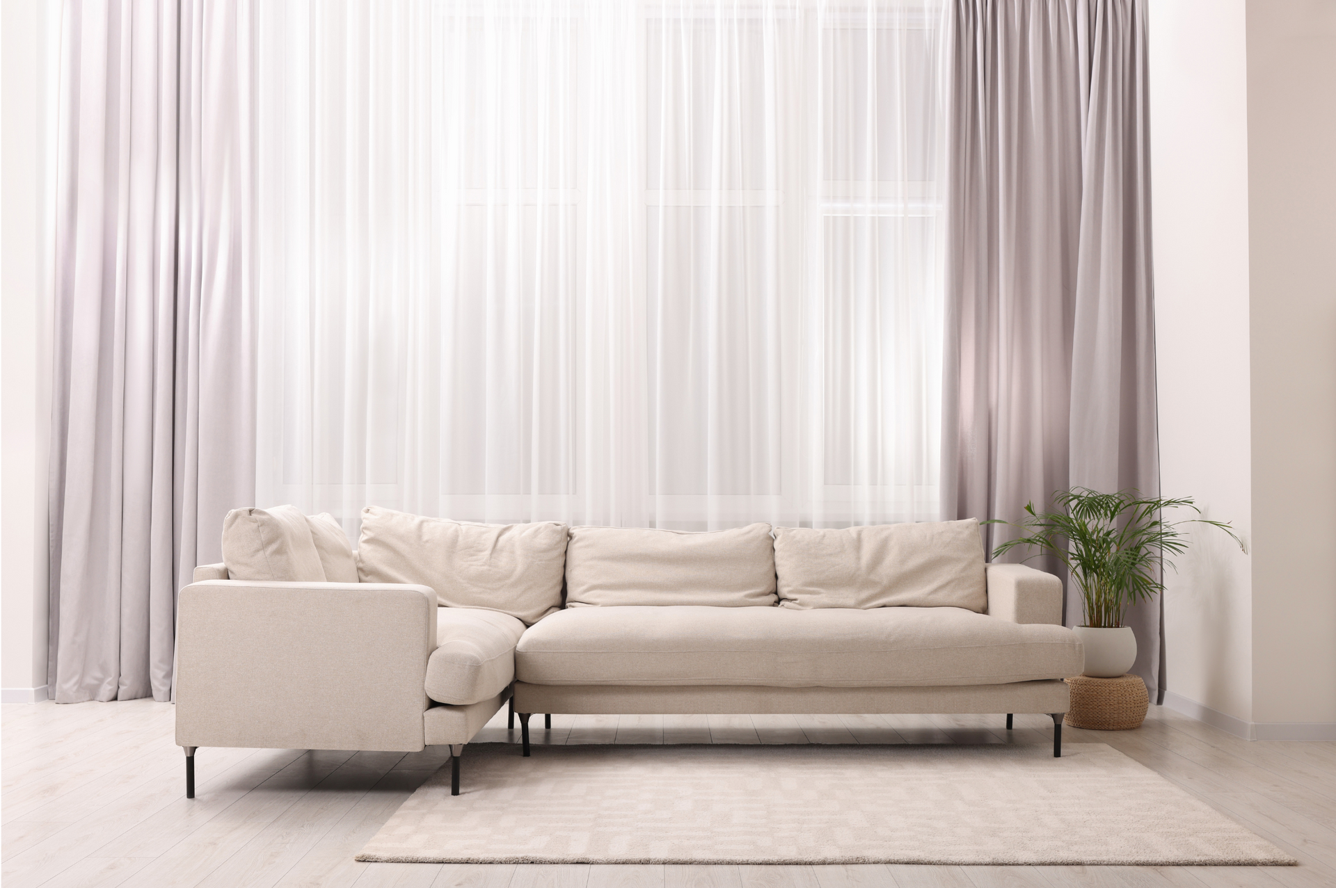 Beige Sectional Sofa in Front of Sheer and Gray Curtains — Carpet 2 Couch In Condon, QLD