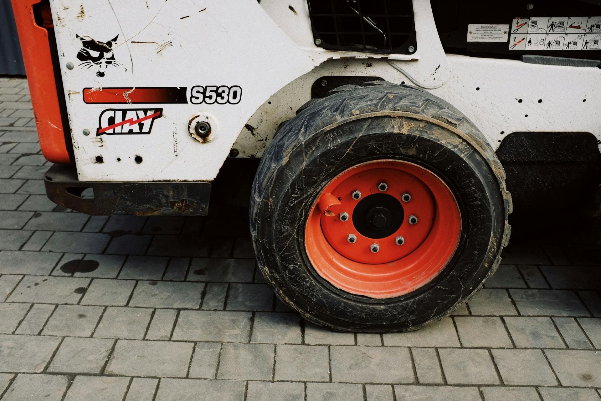 A bobcat 6520 is parked on a brick driveway — B E Laser Levelling QLD in Bucca, QLD