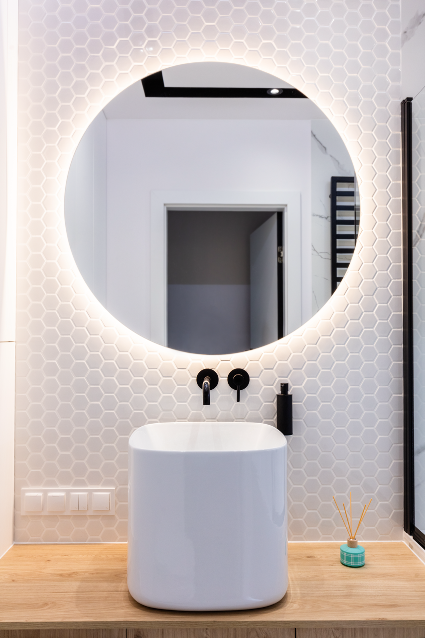A Custom Bathroom Sink & Mirror With Hexagon Penny Tile. Built by Hombs Custom Homes in Mid-Mo.
