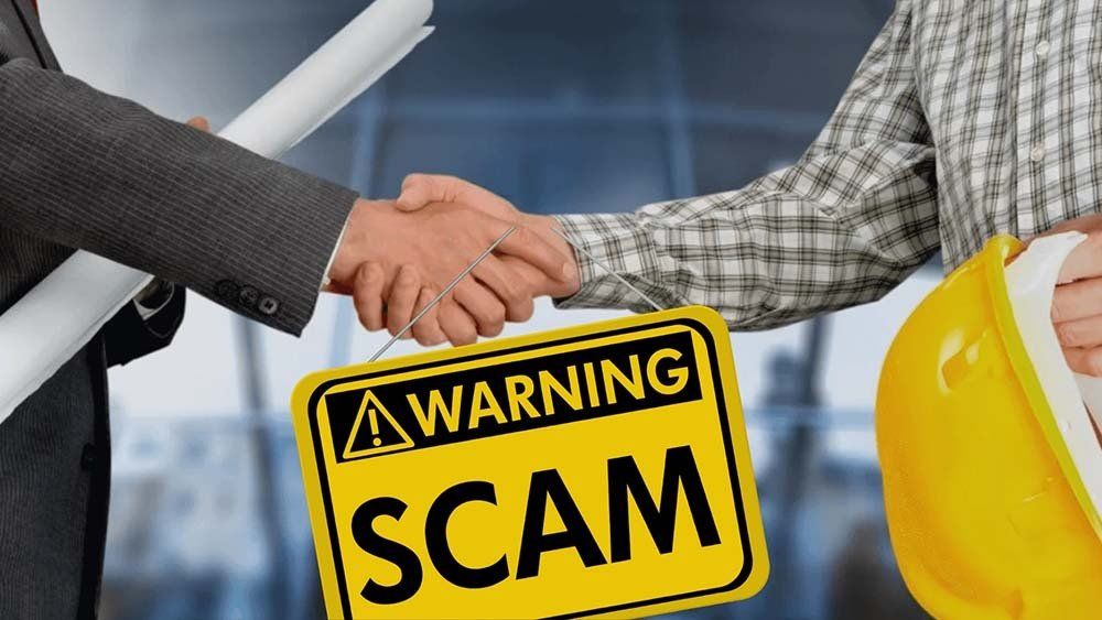 Two men shaking hands and a yellow sign that reads 'warning scam ' is held between their hands