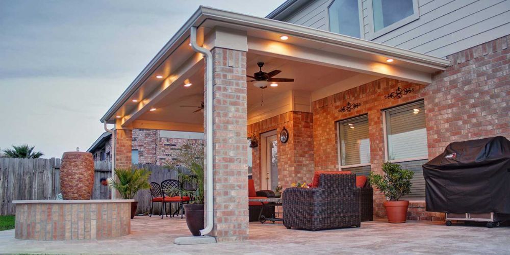 Patio with a brick exterior, shingle roof, outdoor furniture, and a ceiling fan