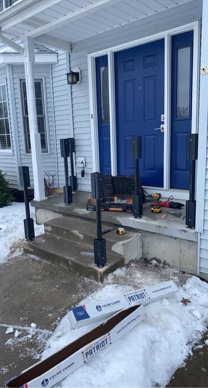 A house's front porch railing installation