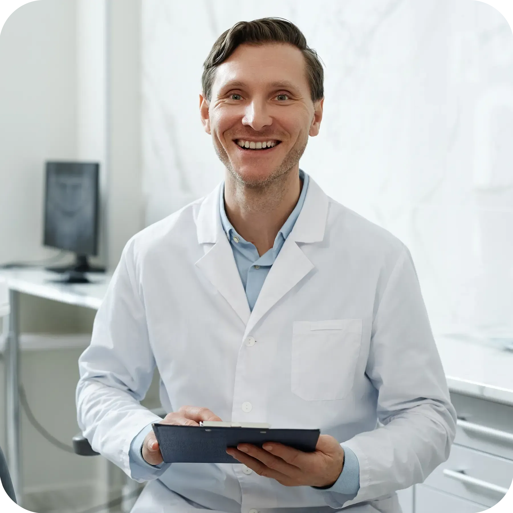 Young attractive dentist smiling