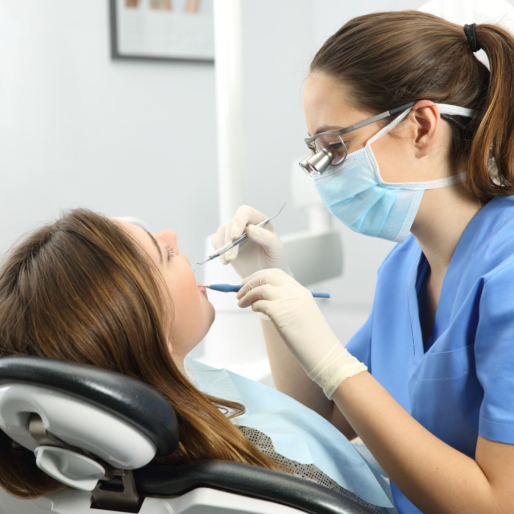 Dentist Checking Teeth of Patient — Strathpine, QLD — Northside Family Smile