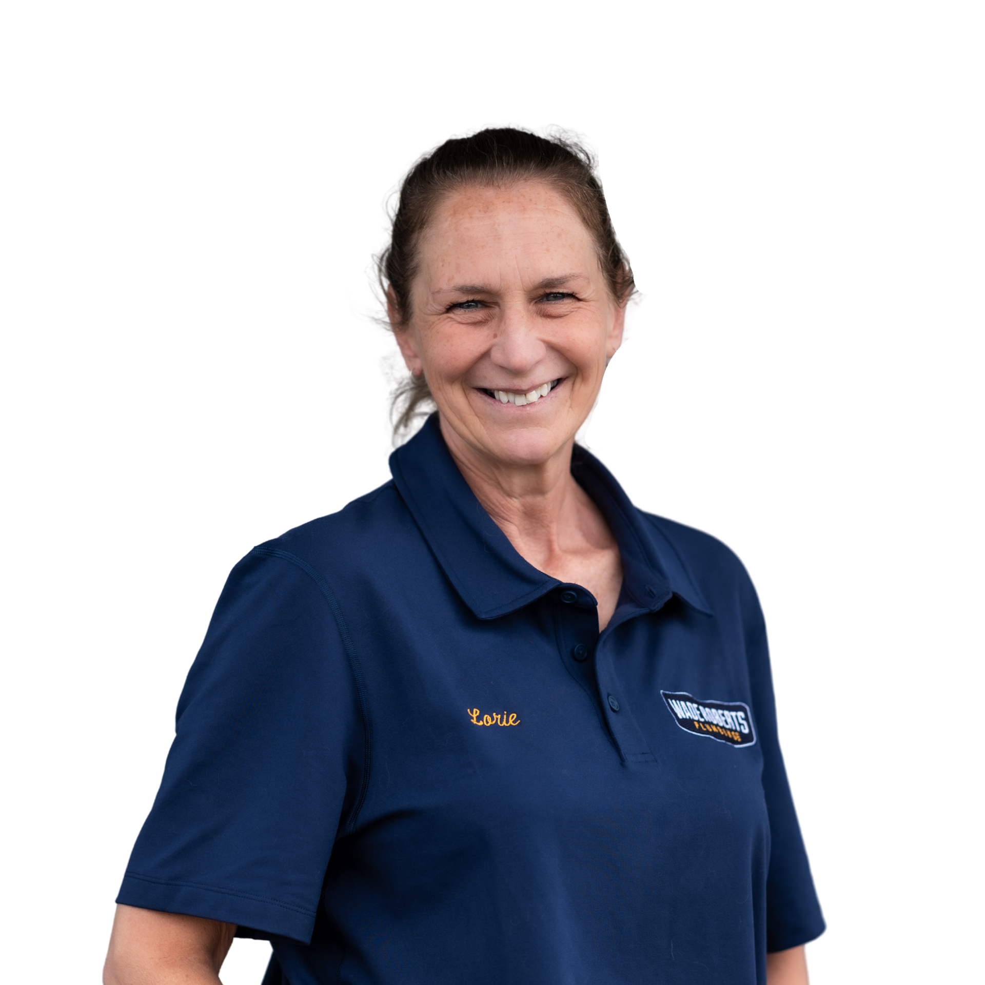 A woman with a bun on her head is smiling for the camera.