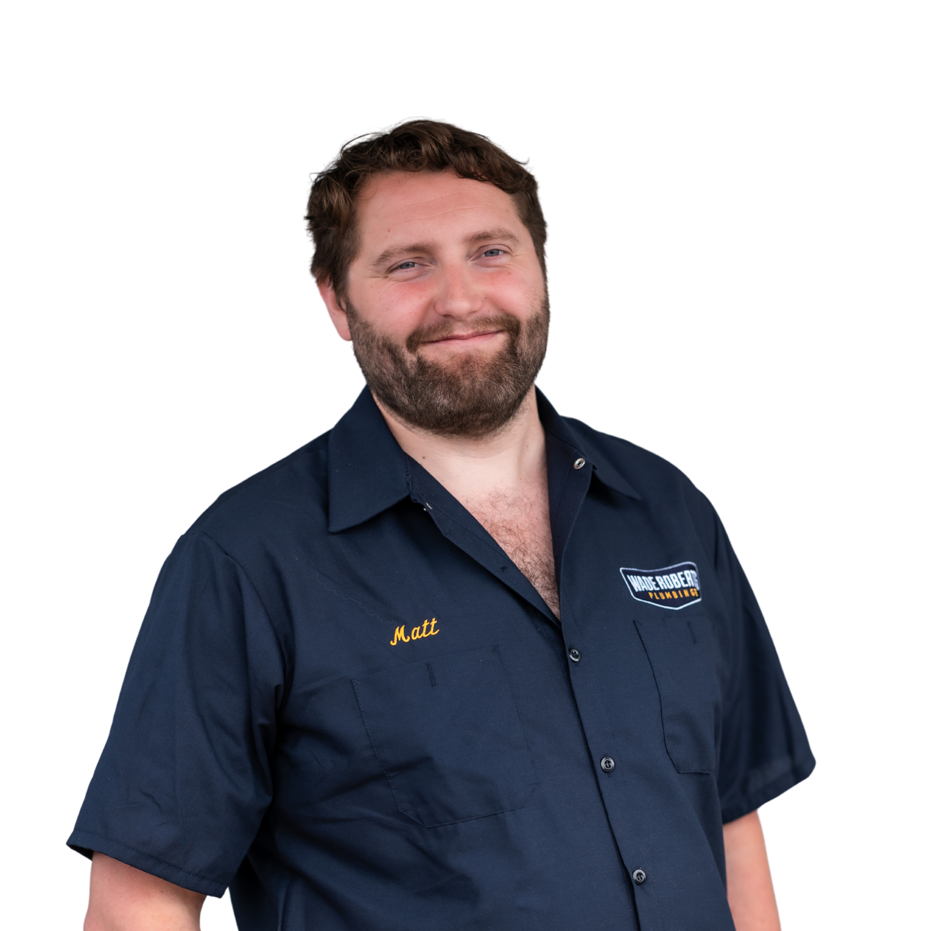 A man with a beard is smiling and wearing a black shirt.