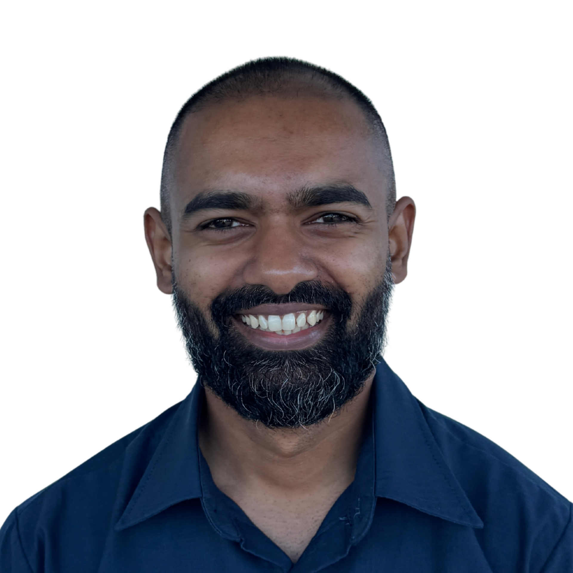 A young man in a black shirt is smiling for the camera.