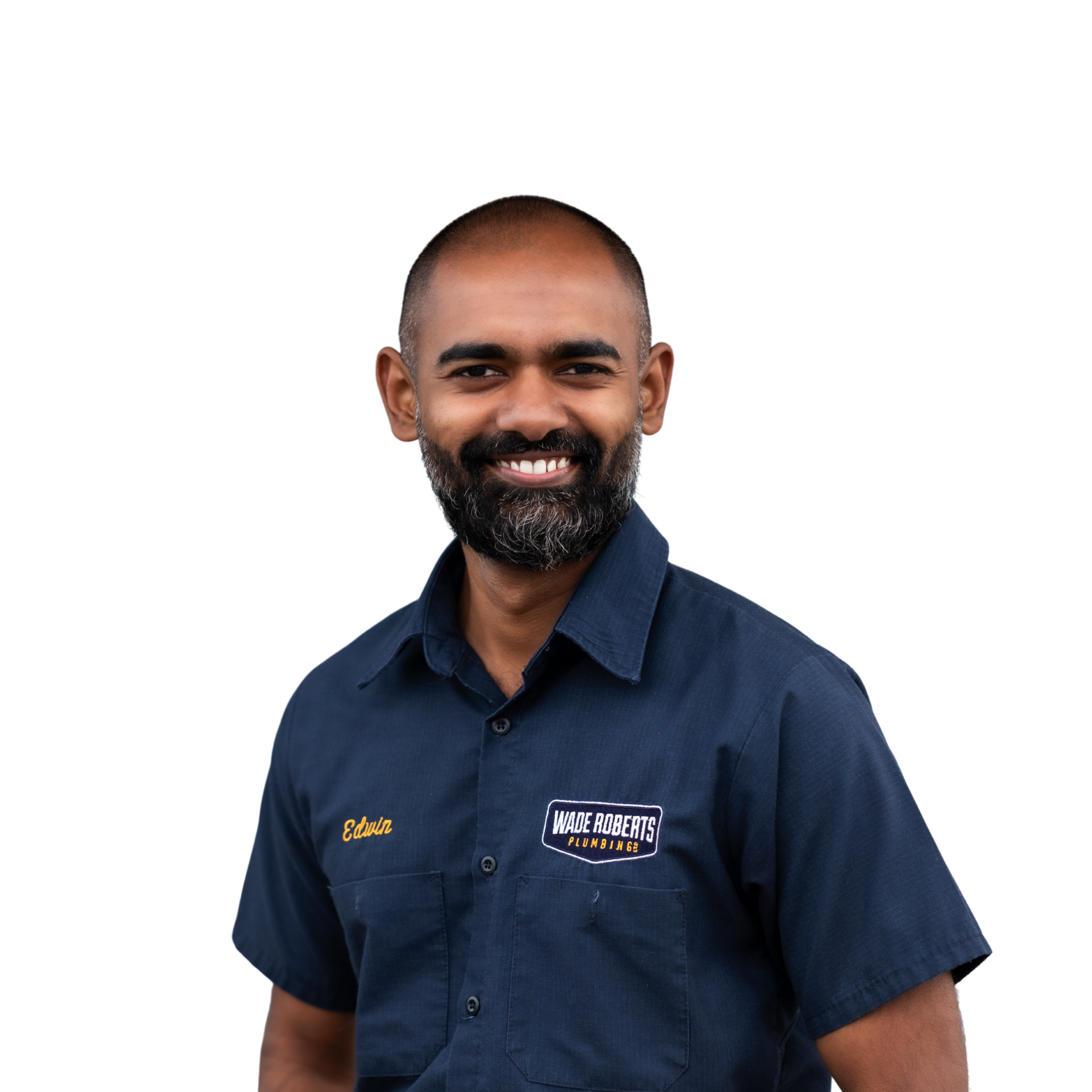 A young man in a black shirt is smiling for the camera.