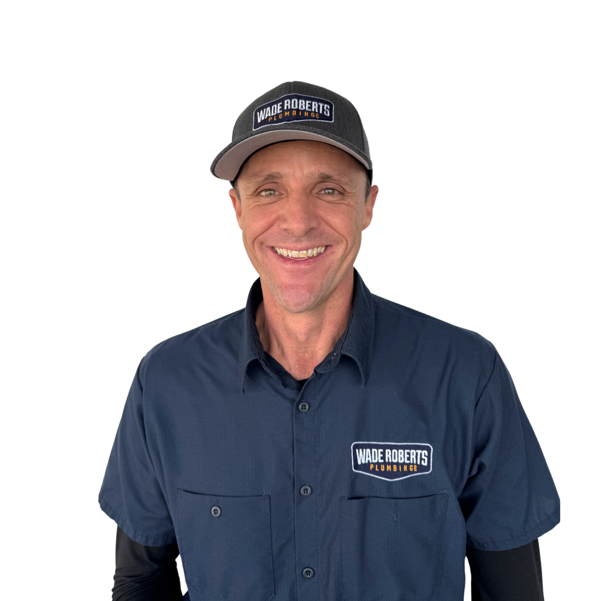 Smiling man in a dark shirt against a white background