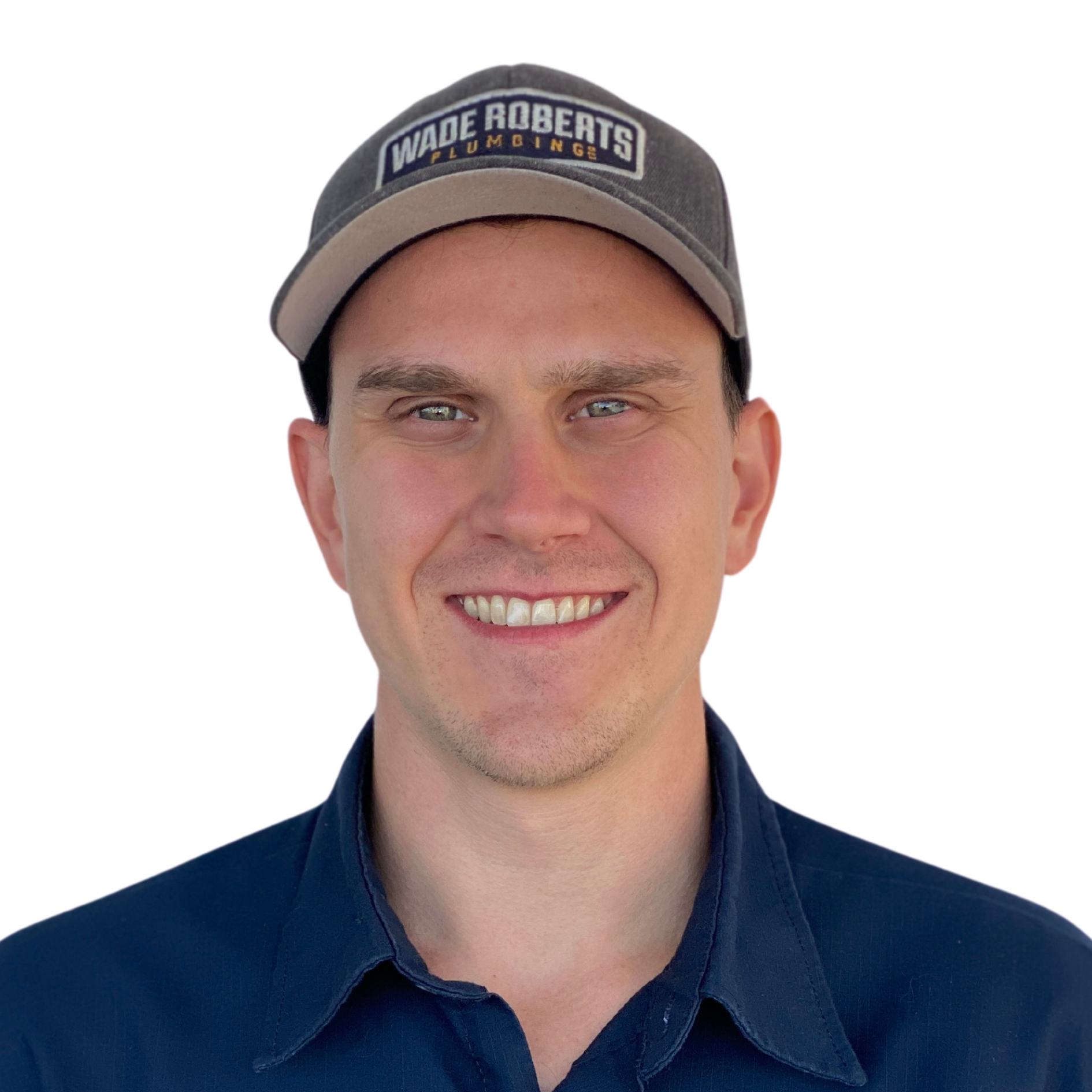 A man wearing a hat that says made roberts is smiling