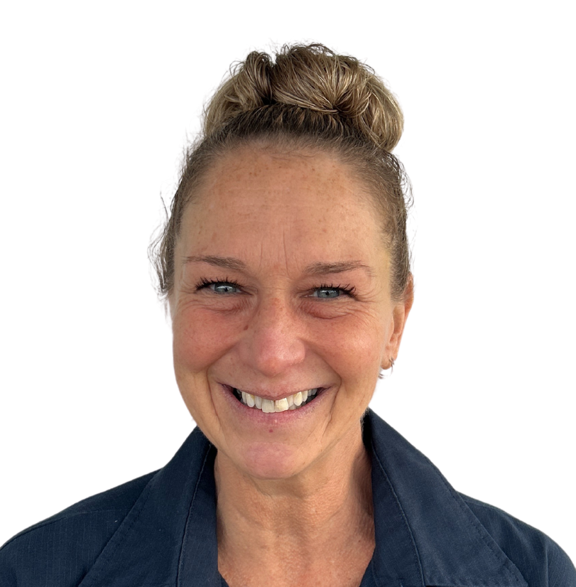 A woman with a bun on her head is smiling for the camera.