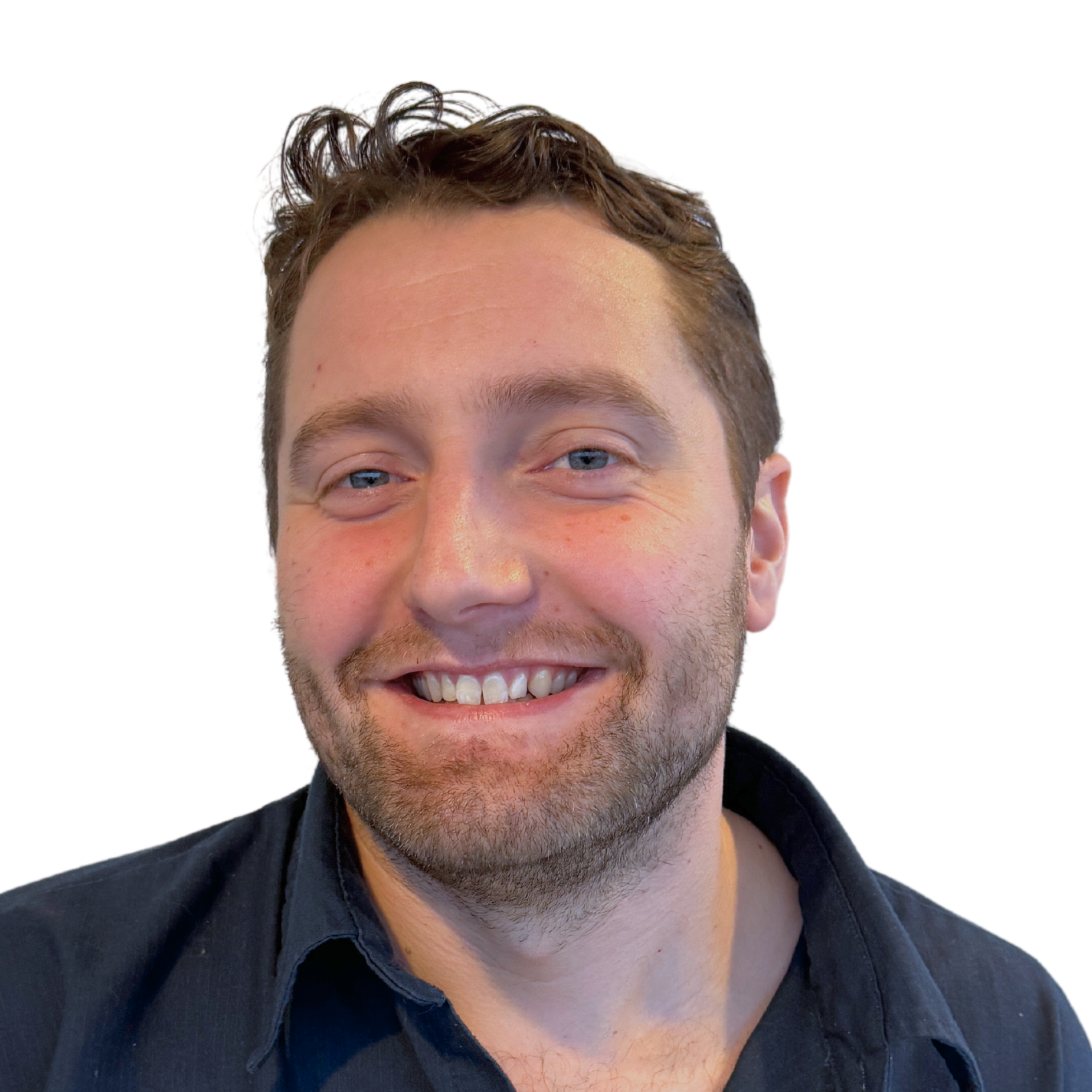 A man with a beard is smiling and wearing a black shirt.