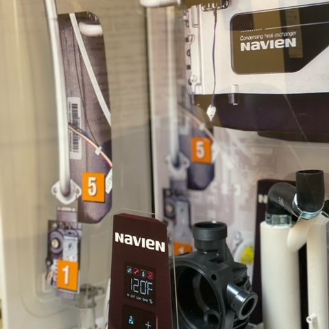 A navien product is displayed in a store