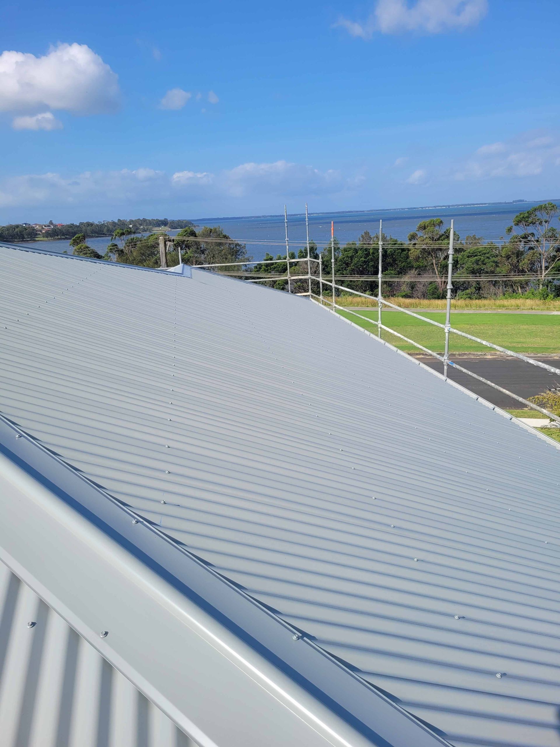 The Roof of a Building With a View of the Ocean — GT Metal Roofing Solutions in Corrimal, NSW