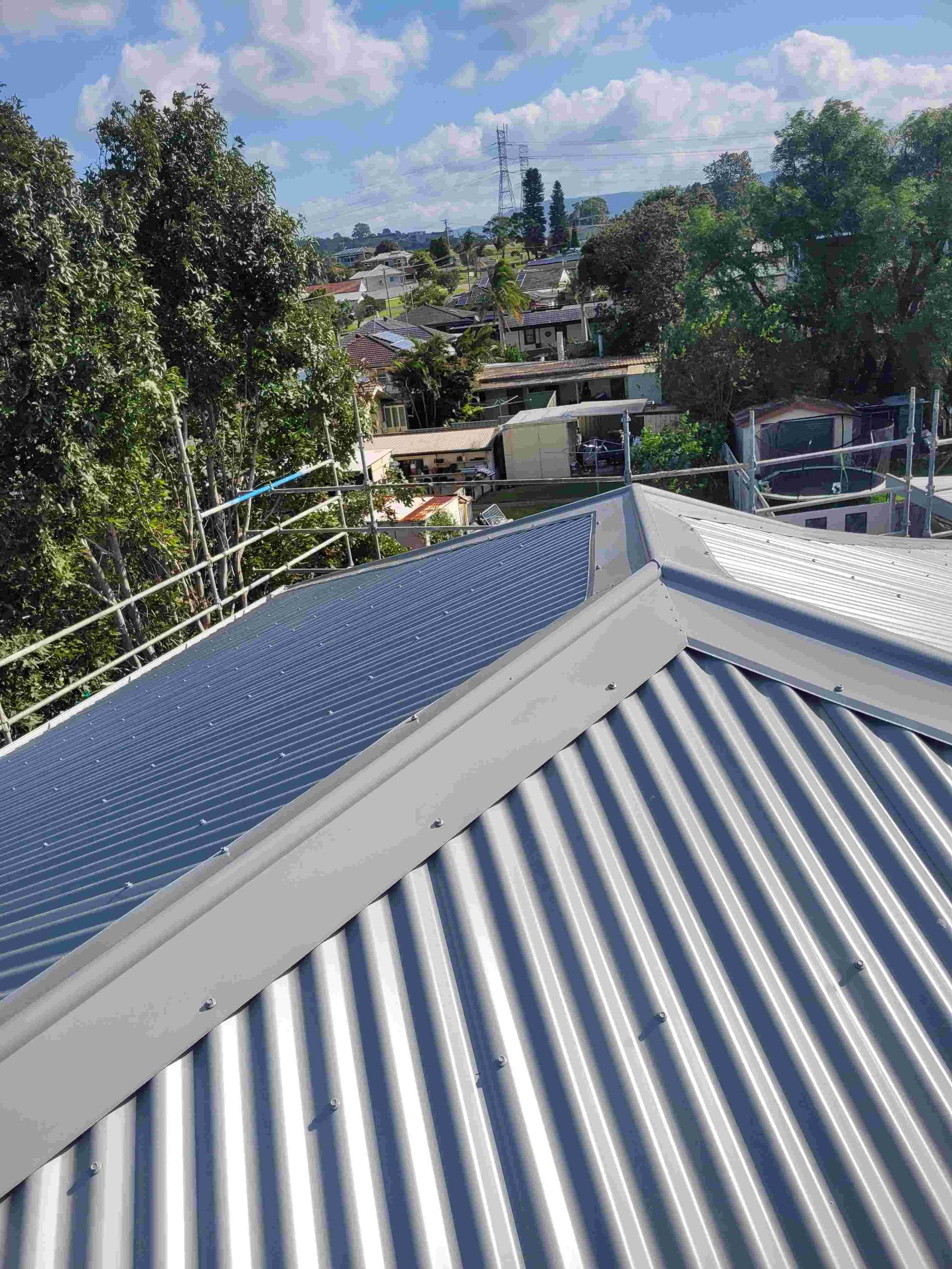 A Roof With a View of a City and Trees on a Sunny Day — GT Metal Roofing Solutions in Wollongong, NSW  
