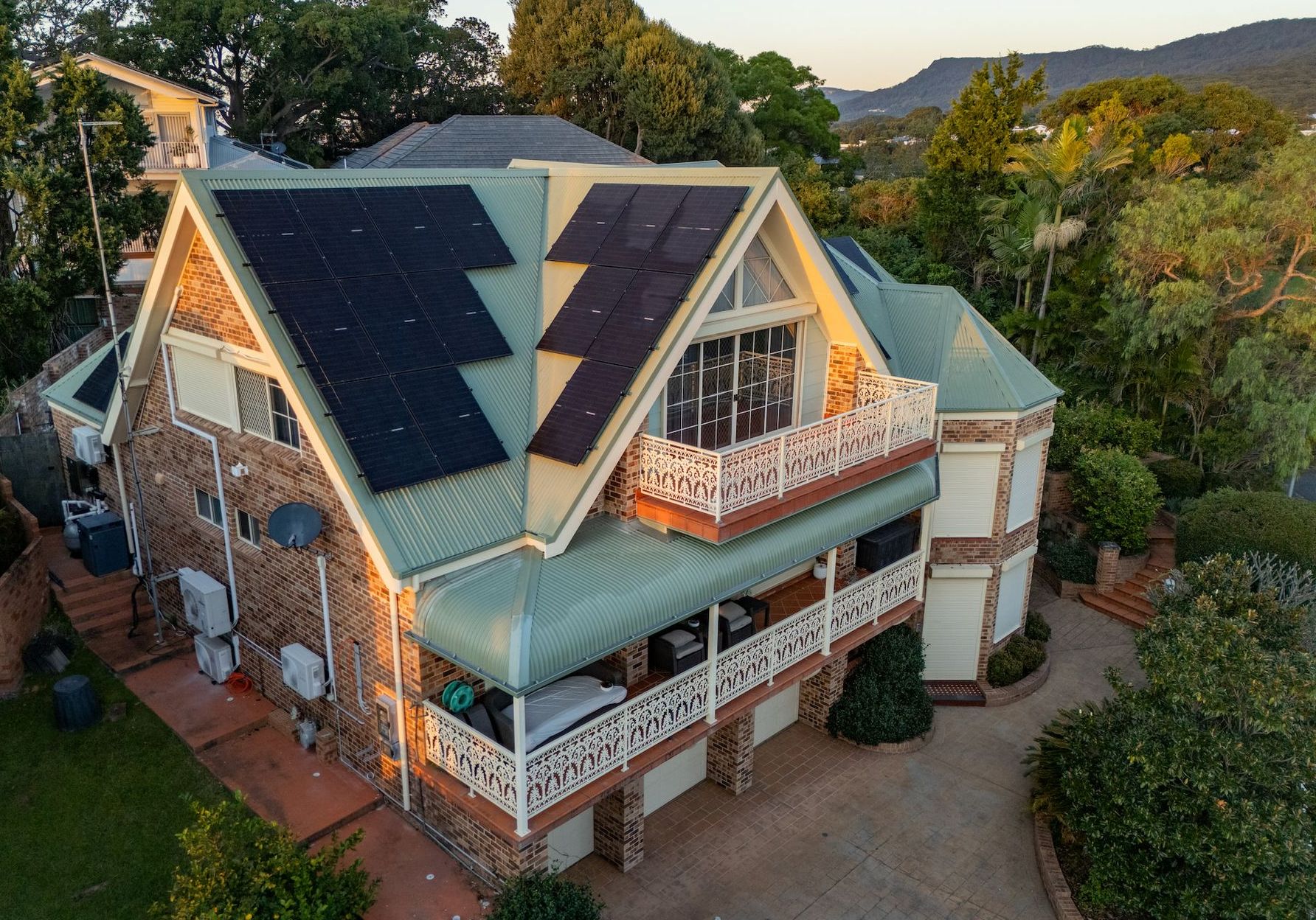 Large brick house with many solar panels — GT Metal Roofing Solutions in Shoalhaven, NSW