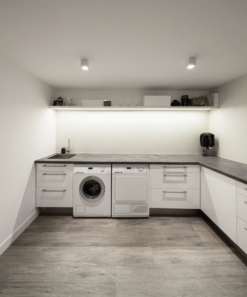 Modern White Laundry Room With Wooden Floor — Kitchen Design Experts in Central Coast, NSW