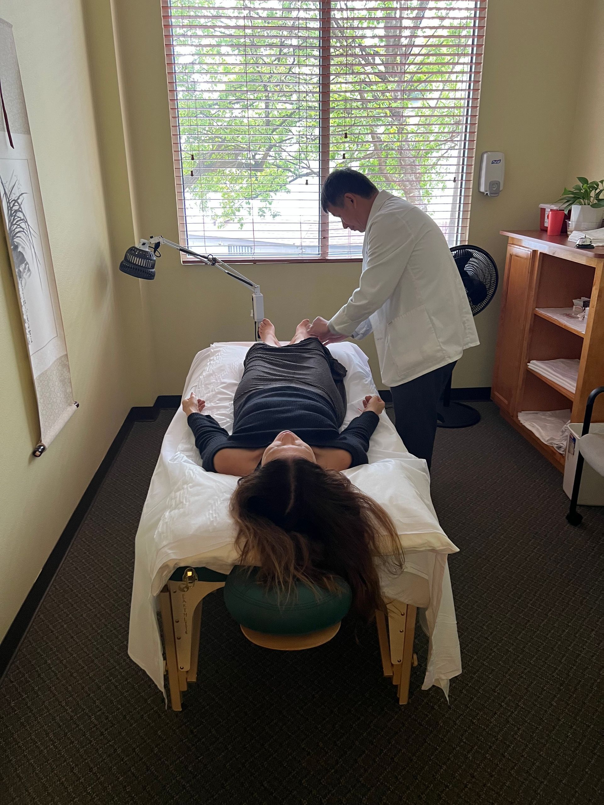 Female Receiving Acupuncture Female Receiving Acupuncture