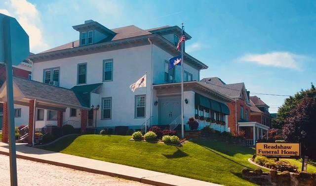 White building with flags,