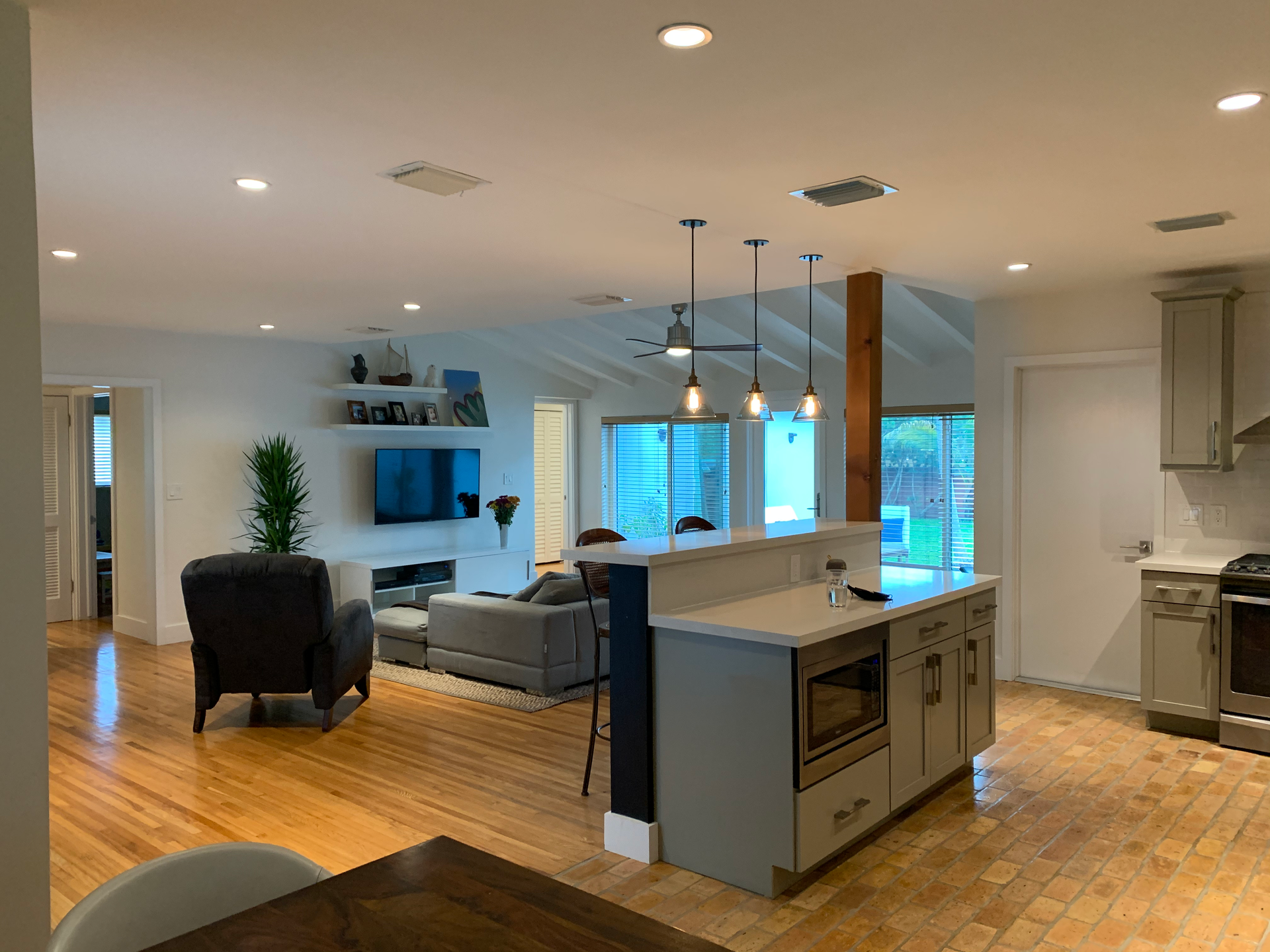 A kitchen with a large island in the middle of the room.