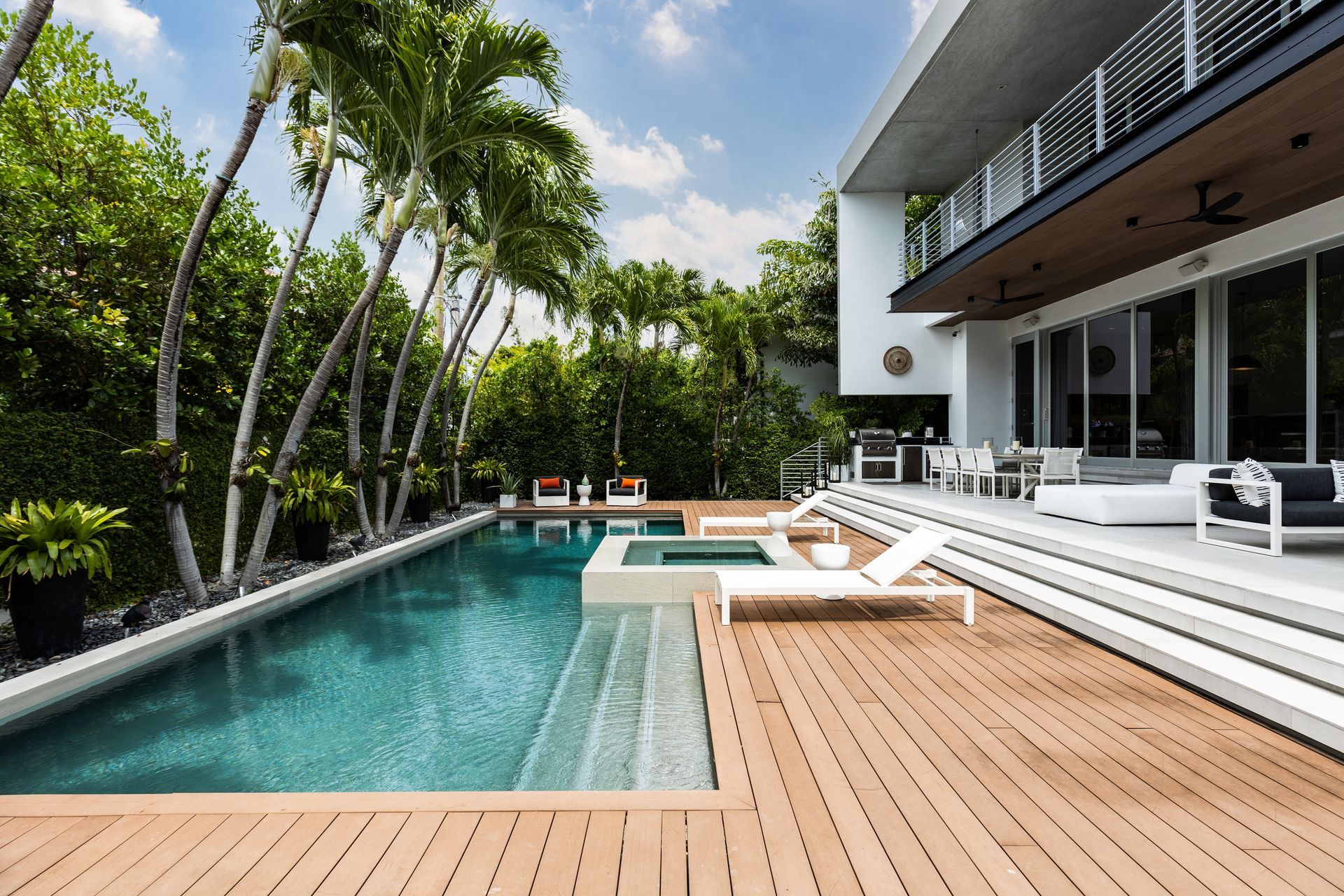 A large swimming pool in the backyard of a house