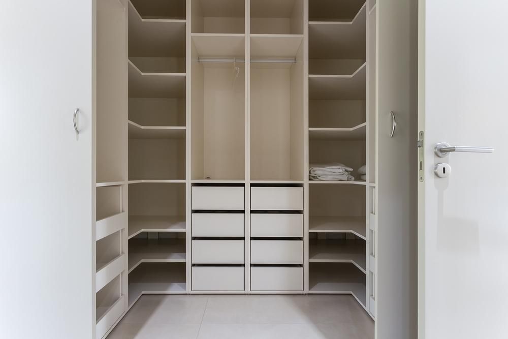 It is a Walk in Closet With Lots of Shelves and Drawers — Mackay Cabinetmaking Service In Glenella, QLD