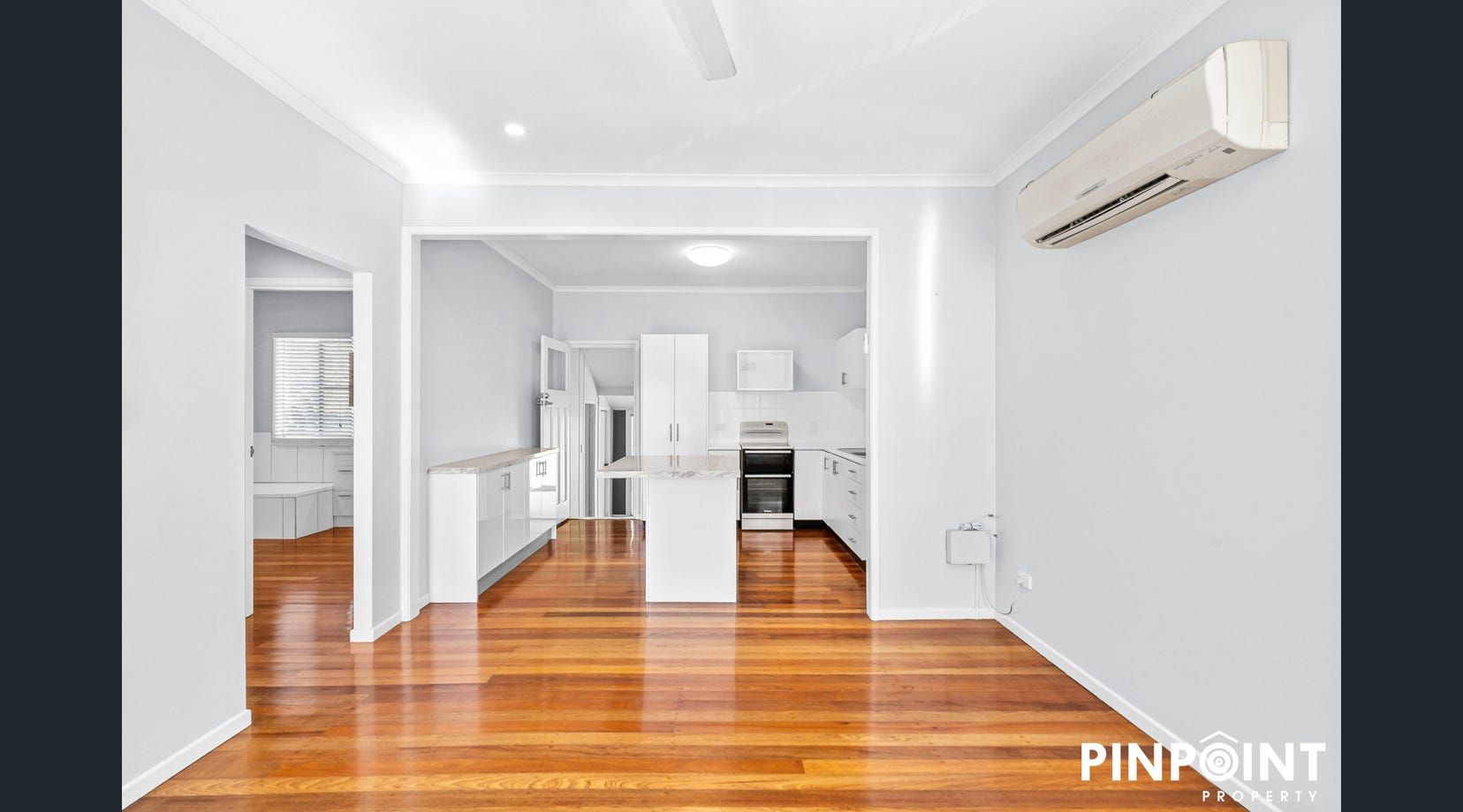 A Kitchen With White Cabinets and Drawers Open — Mackay Cabinetmaking Service In Glenella, QLD