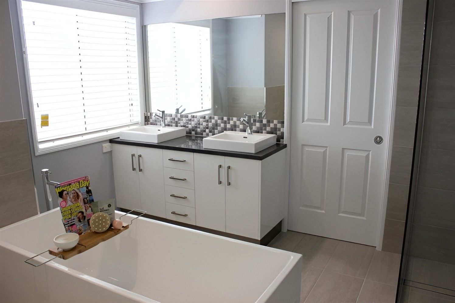A Bathroom With Two Sinks and a Bathtub — Mackay Cabinetmaking Service In Sarina, QLD