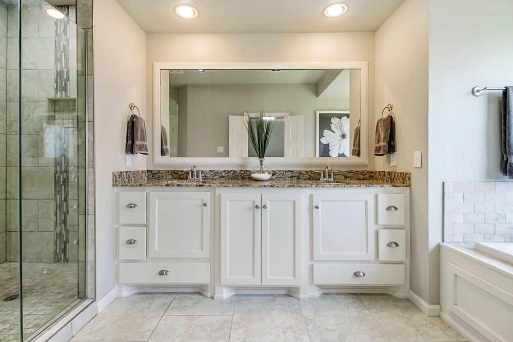 A Bathroom With Two Sinks and a Large Mirror — Mackay Cabinetmaking Service In Glenella, QLD