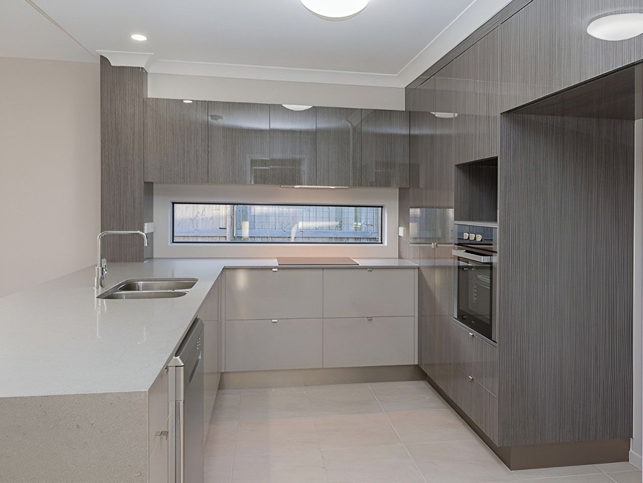 A Kitchen With Cabinets and Counter Tops — Mackay Cabinetmaking Service In Glenella, QLD