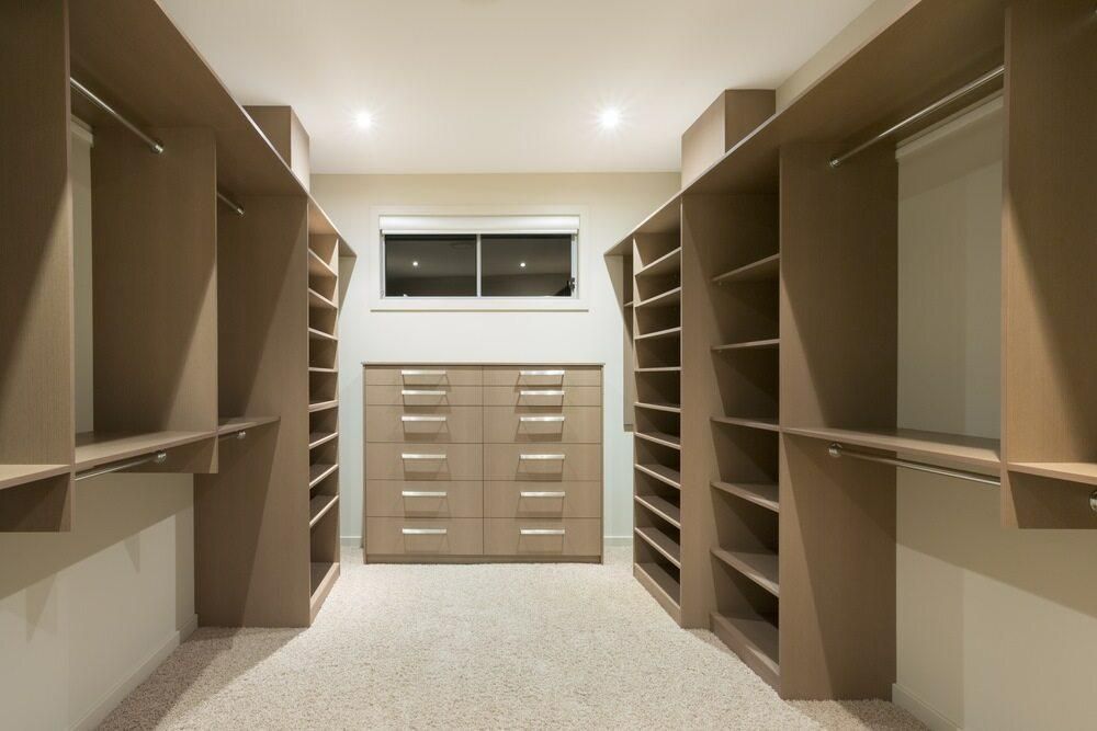 Walk-in closet with built-in shelves and drawers — Mackay Cabinetmaking Service In Glenella, QLD
