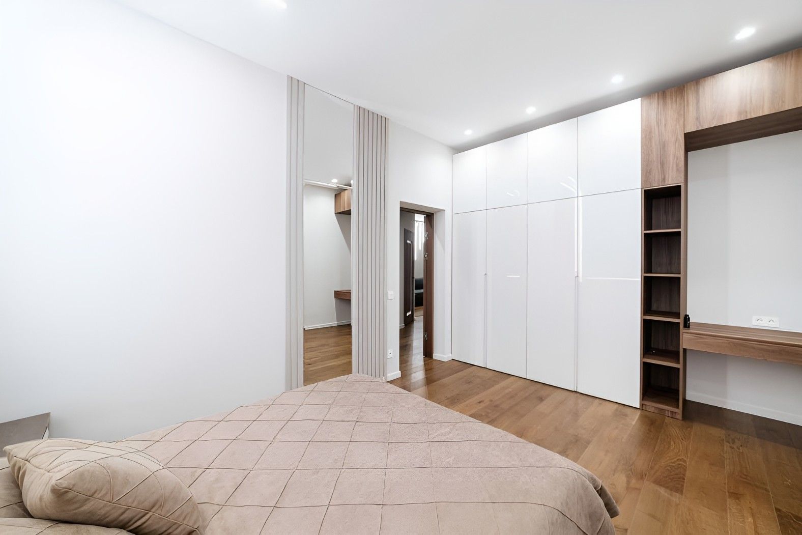 A Bedroom With a Bed, Closet, and Mirror — Mackay Cabinetmaking Service In Glenella, QLD