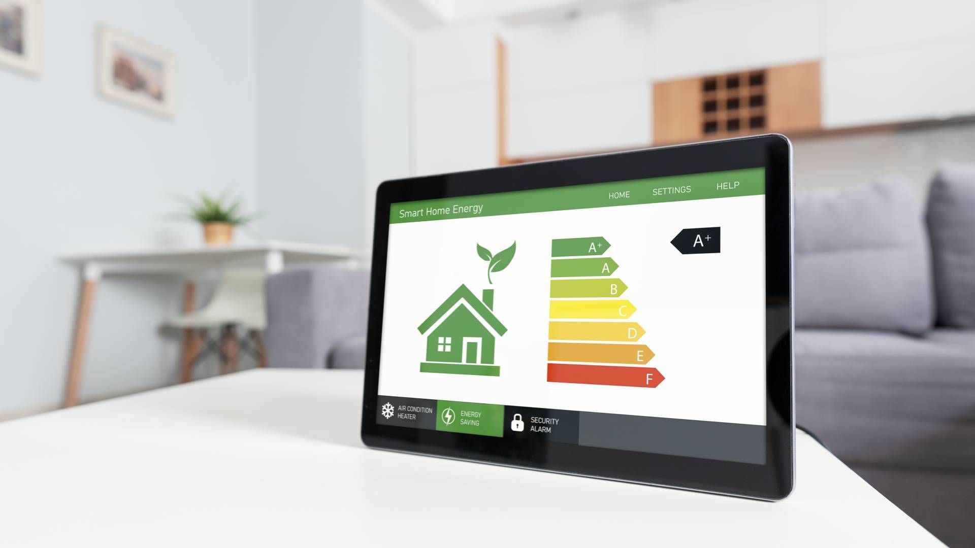 Tablet displaying a home energy efficiency rating, resting on a white table in a living room.